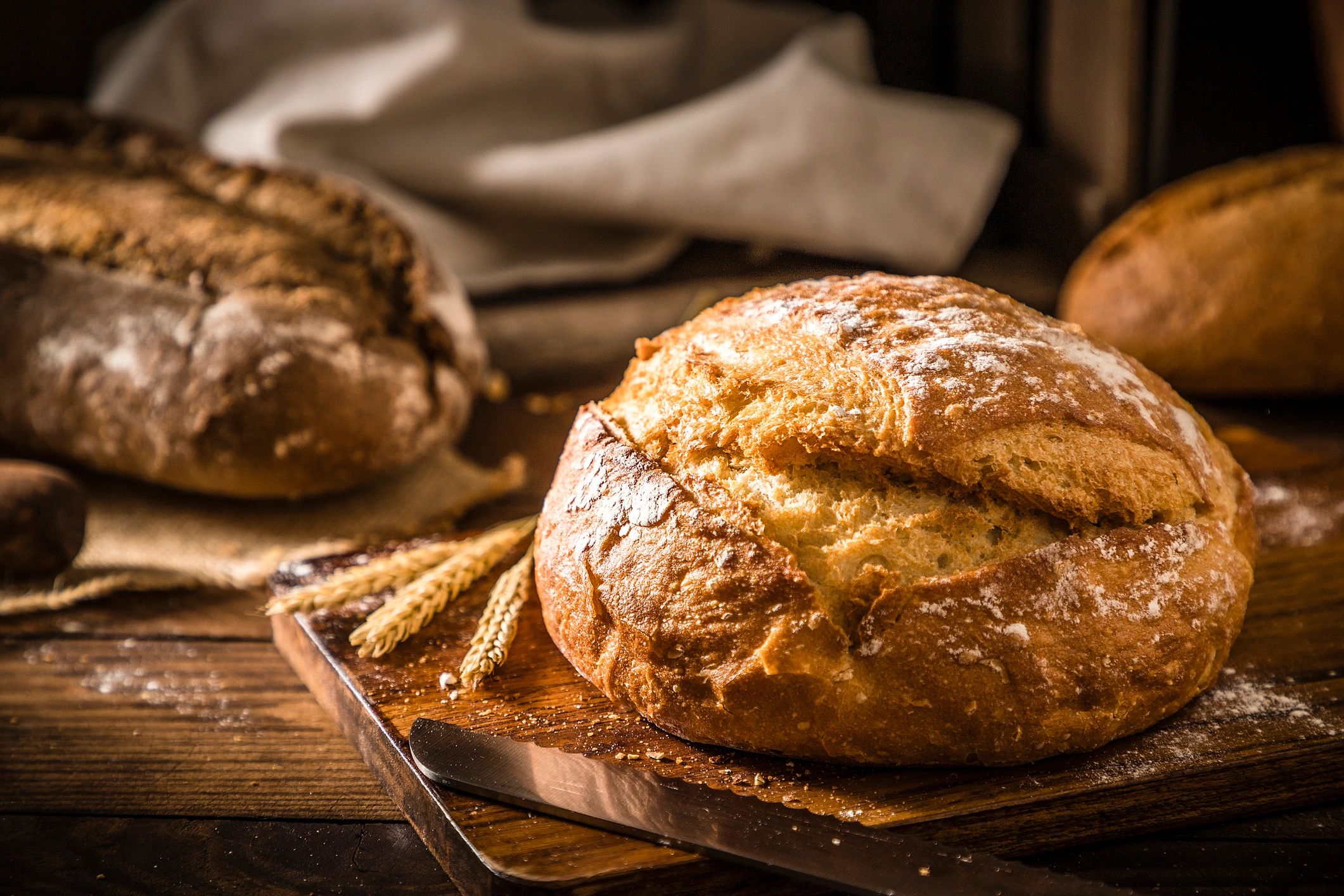 Loaf of artisan bread on a rustic wooden table