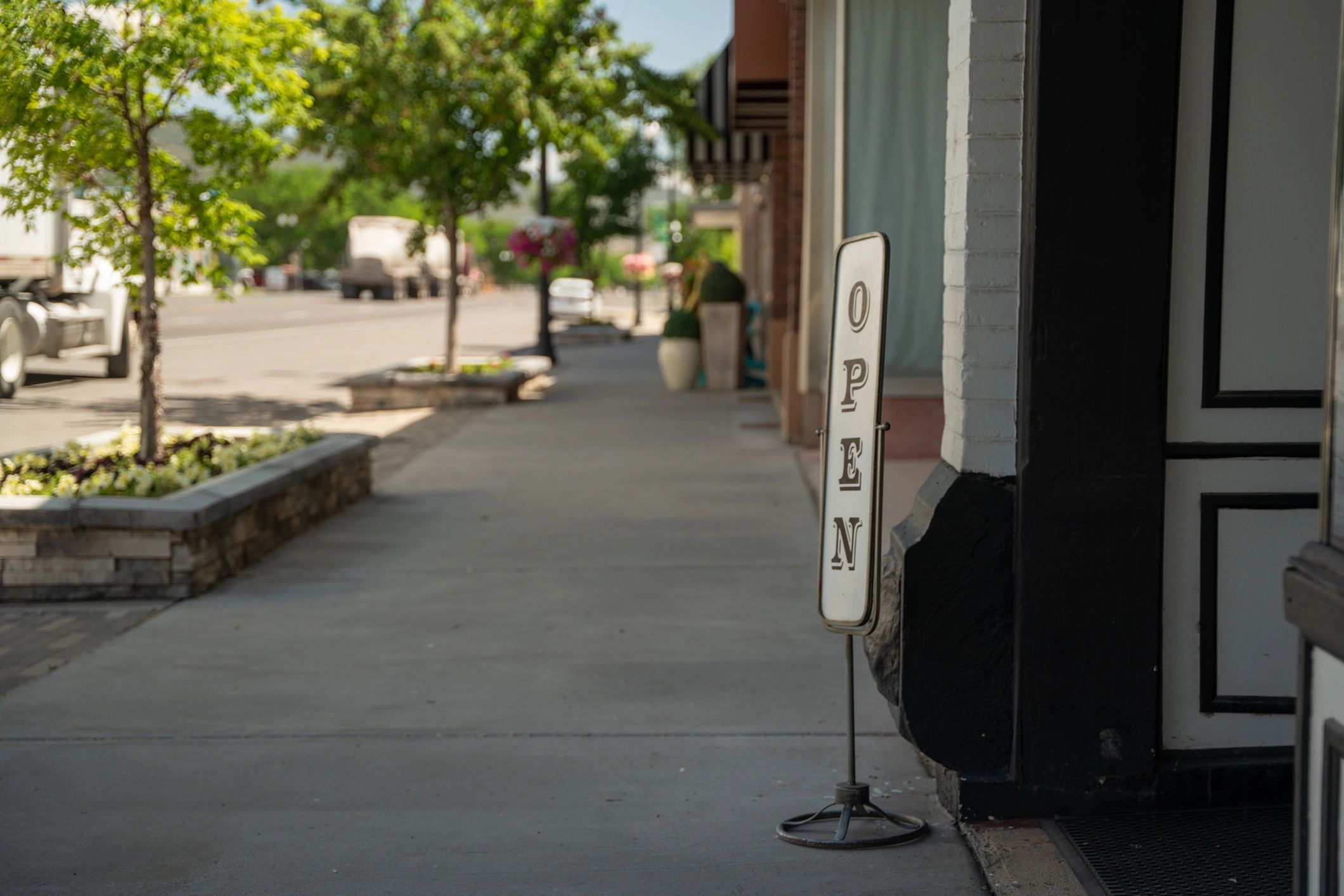 Small storefront entrance with an open sign